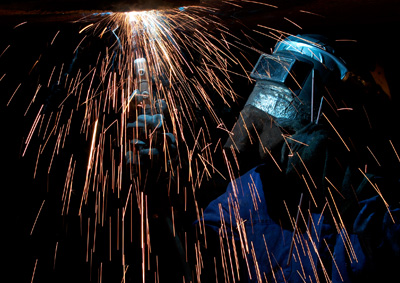 welder welding with fire sparks welder welding with fire sparks